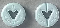  Valium 10 mg (greatly enlarged). Note the characteristic heart-shaped cut out holes 